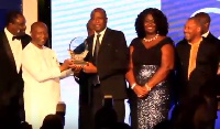 Mtn receiving their award from the Finance Minister Ken Ofori Atta