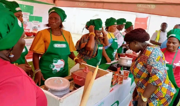 Dzifa Gomashie inspecting some of the work by the queen mothers