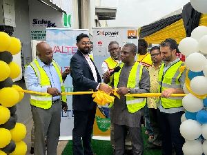Richard Gyan-Mensah cutting the ribbon to inaugurate the solar system