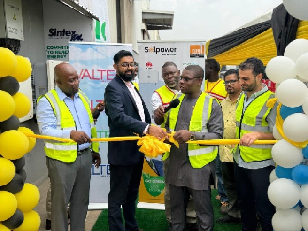 Richard Gyan-Mensah cutting the ribbon to inaugurate the solar system