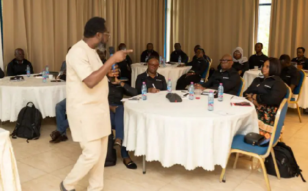 Professor Kobby Mensah interacting with some of the staff