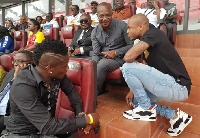 Asamoah Gyan and Dede Ayew interacting with Coach Kwesi Appiah