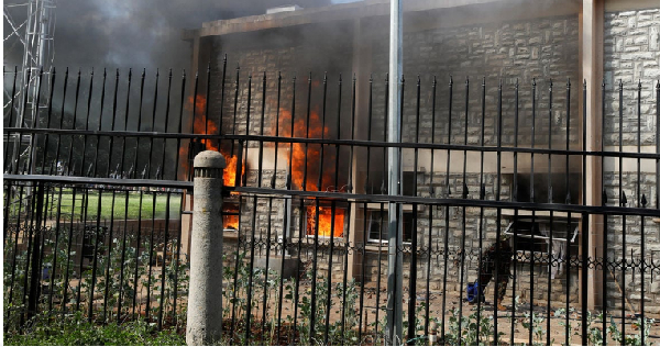 Sections of Kenya's parliament were on fire on Tuesday as protesters overwhelmed police