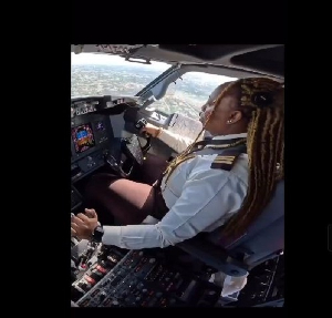 The female pilot captured in a poised manner
