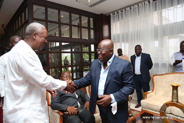 President Mahama in a handshake with his soon-to-be successor, Nana Akufo-Addo