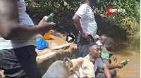 The youth performing rituals in the Offin stream