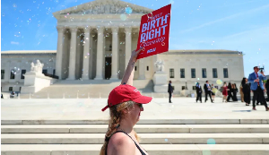 Demonstrators rally outside the US Supreme Court in support of birthright citizenship in Washington