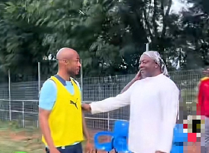 Dede (L) and his dad Abedi Pele (R) before his training