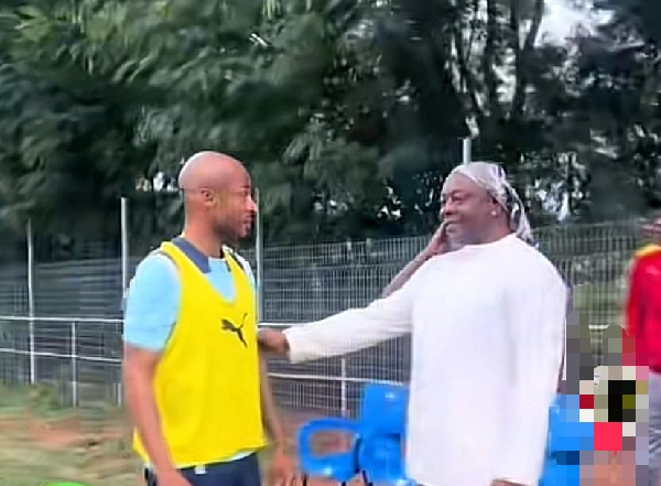 Dede (L) and his dad Abedi Pele (R) before his training