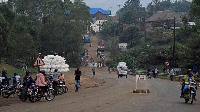 Ugandan merchants arrive at the Mpondwe check point to cross the border to Congo