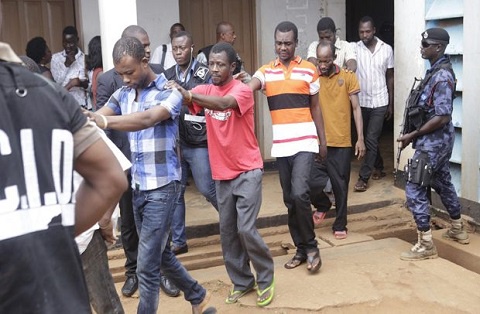 The 14 were among 22 persons arraigned before the court on charges of murder
