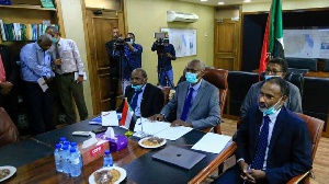 Sudan's Minister of Irrigation and Water Resources Yasir Mohamed (centre) in a video meeting