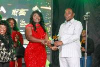 Rebecca Benle is seen receiving an award as the best Hair Plaiter of the year