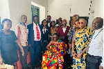 Nana Gyan Akwandah surrounded by the delegation from the Judicial Service