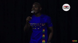 Comedian OB on stage at 'Laughline'