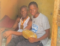 Afi Amenyeku with his grandfather