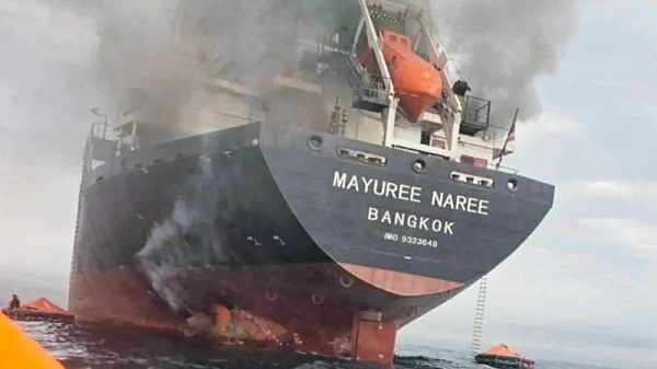 A Thai cargo ship on fire after being struck by a projectile 11 nautical miles north of Oman