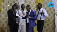 Rev. Isaac Owusu Bempah preaching during a prophetic session in January