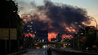 Smoke from overnight Russian missile and drone strikes rises over Kyiv