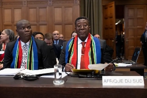 Vusimuzi Madonsela, South Africa's justice minister, attend the first hearing of genocide case
