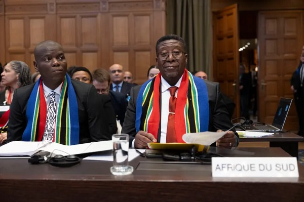 Vusimuzi Madonsela, South Africa's justice minister, attend the first hearing of genocide case