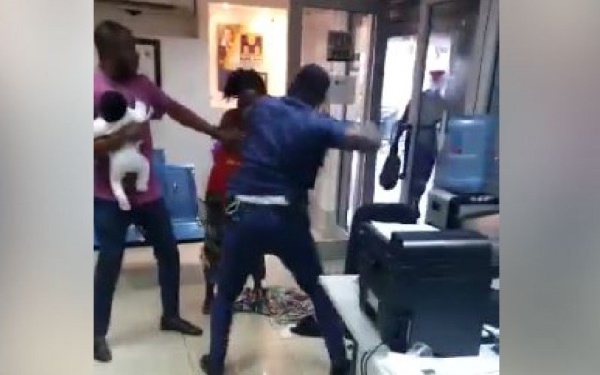 The police officer assaulting the nursing mother at the banking hall