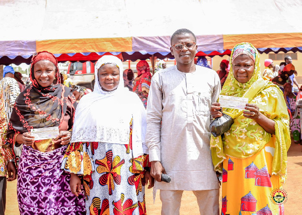 Dr Amin Adam in a pose with some beneficiaries