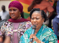 Kate Gyamfua receiving speaking during a function