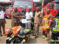TDF Organizer, Mr. Victor Kalala donating the items to the Sunyani Fire Service