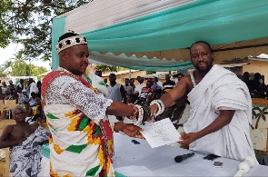 A chief receives his certificate at the ceremony