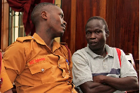 Lord's Resistance Army (LRA) commander Thomas Kwoyelo, right, is pictured during a pre-trial session