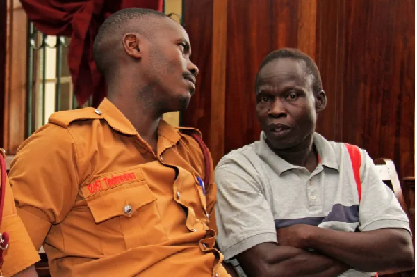 Lord's Resistance Army (LRA) commander Thomas Kwoyelo, right, is pictured during a pre-trial session