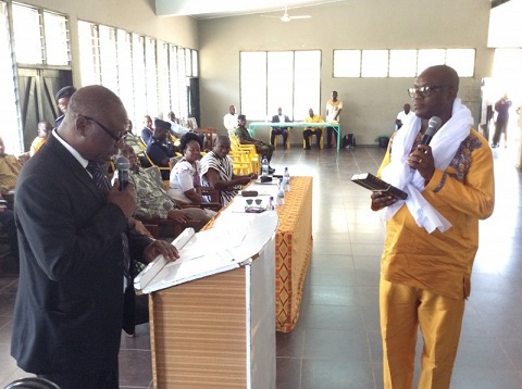 Mr. Seddoh (Right) taking his oath of office