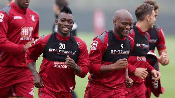 Atsu (middle) trains with Bournemouth