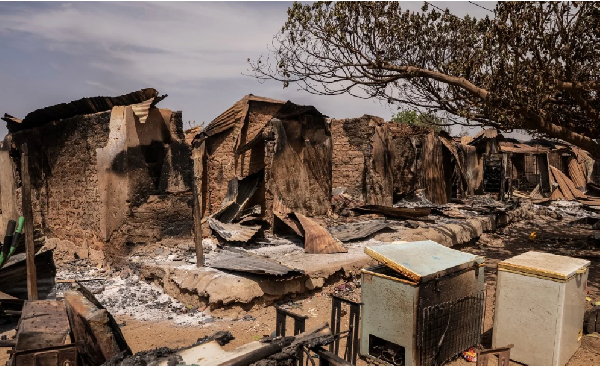 A general views of burnt debris and damaged homes following the attack in Woro, Kwara State