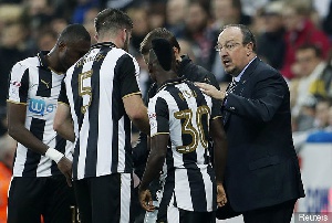 Atsu and other Newcastle players taking instructions from Coach Benitez