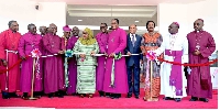 President Samia Suluhu Hassan (C) flanked by Anglican Church of Tanzania bishops and govt. officials