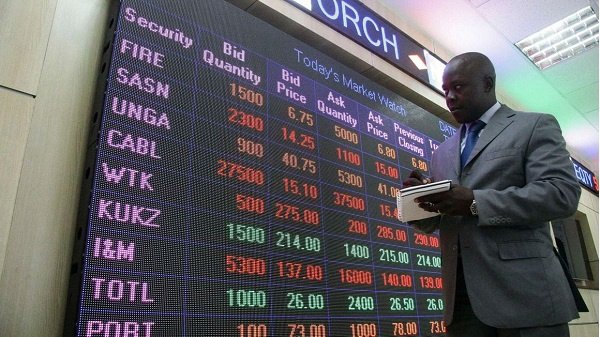 Nairobi Securities Exchange employee checks the stock trading on board at the NSE head offices