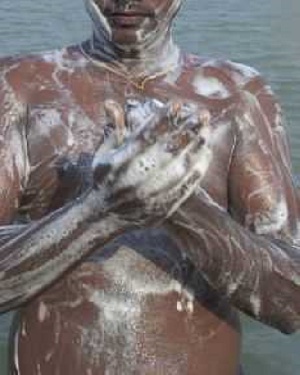 NPP supporter takes his bath on the street