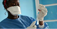 File photo of ebola vaccines being prepared in 2018