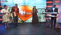 Hosts Kafui Dey and Baisiwa Dowuona-Hammond (ll) dancing to some hyms
