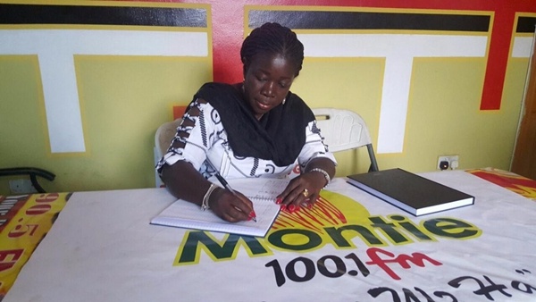 Mrs Elizabeth Ofosu-Adjare, Minister for Tourism, Culture and Creative Arts signing petition