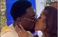 Too Sweet Annan (left) kissing his wife, Msflava (right) during their marriage ceremony