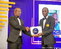 Ernest Owusu-Bempah receiving his award