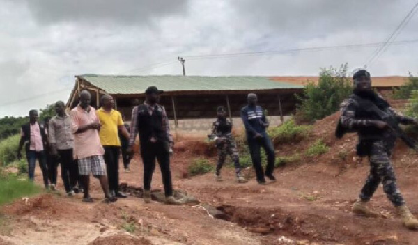 Michael Ekow Clarke Quansah in the company of police