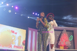 Becca and Bisa Kdei on stage performing