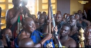 Otumfuo Holding The Agyaponmaa   The Gun With The Bead Of An Asantehene's Wife