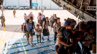 French and other nationalities embark at French military air base in Khartoum to fly to Djibouti