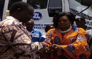Mr. Samuel Oppong receiving the keys of the trucks