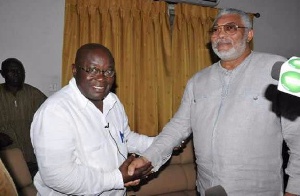 J.J. Rawlings (right) in a handshake with president-elect Akufo-Addo